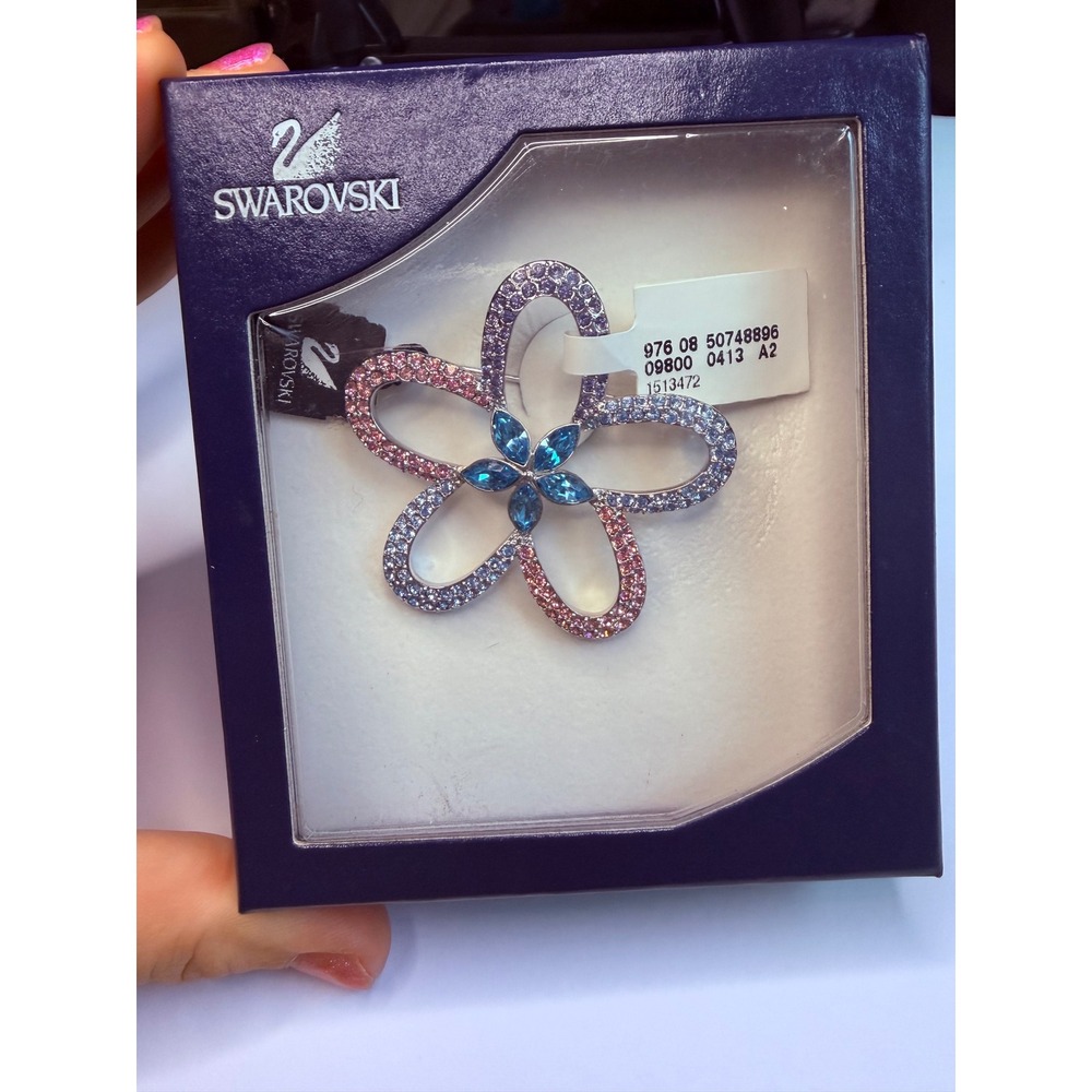 retired Swarovski crystal flower pin featuring pavé petals